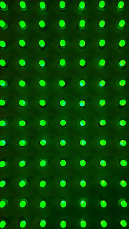 green Disco wall background in neon led dot lighting.pipes and lamps on the wall. light bulbs pattern.LED decoration lights idea on wall.modern decoration.の写真素材