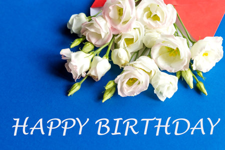 composition with bouquet with eustoma, envelope. Floral decorative elements on yellow background.Happy birthday Day concept. text. Eustoma flowersの写真素材
