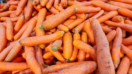 Texture background of fresh large orange carrots. Seamless carrot pattern.ripe carrot background,...