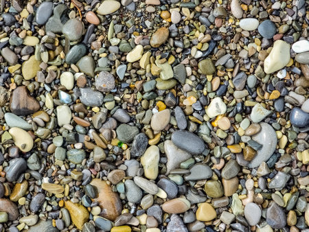 Small round stones background. stone texture. Rough surface of small pebble stone.の写真素材
