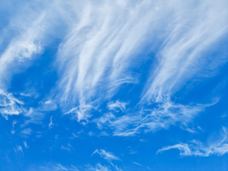 Beautiful Cirrus clouds with blue sky, The Cirrus clouds with clear blue sky background in midday.clear day clouds and nice weather for the summer poster.meteorology and weather forecast concepts.の写真素材
