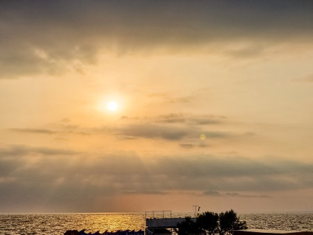 sunset at coast of the lake. nature landscape. Nature in Northern Europe. reflection, blue sky and yellow sunlight. landscape during sunset.の写真素材