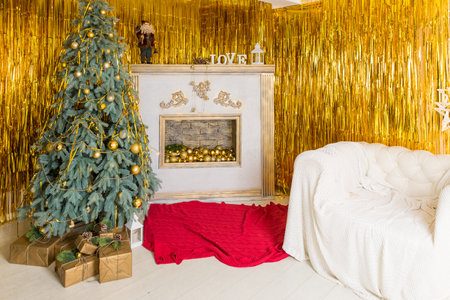 Christmas tree, New Year home decorations, golden baubles, traditional celebration. Copy space. cozy home interior.New Years winter holidays.の写真素材