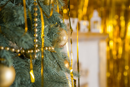 Christmas tree, New Year home decorations, golden baubles, traditional celebration. Copy space. cozy home interior.New Years winter holidays.の写真素材
