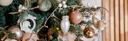 Diy wooden, paper christmas ornaments hanging from Christmas tree.Festive winter holidays...