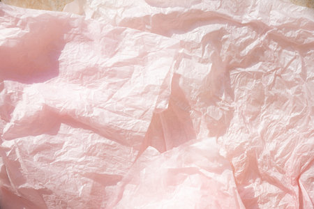 deep rose colored crumpled paper texture background for design, decorative. rumpled recycle paper...