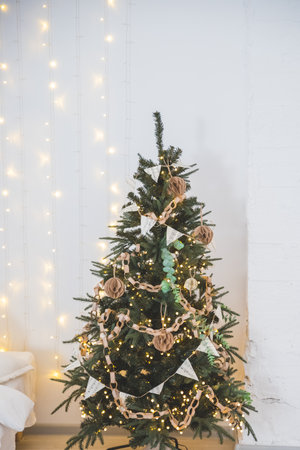 Fashionable eco-friendly Christmas tree toys made of paper, New Years garland. Eco friendly Christmas background.DIY Christmas home decor from natural materials.の写真素材