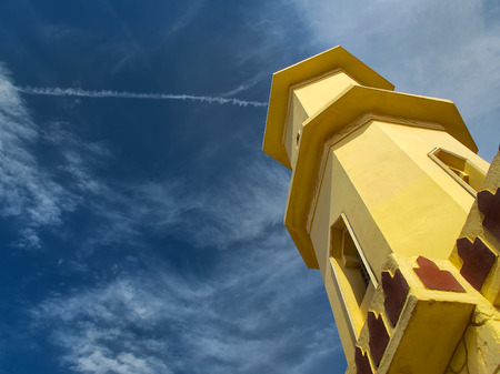 Minaret of a mosque in the countryside close to Hurghada in Egypt. Details of the architecture. Cloudy sky in the background.の写真素材