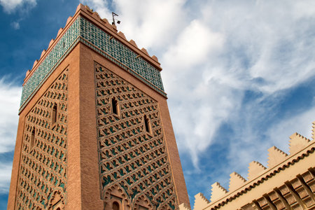 Tower of a famous mosque in medina of Marrakesh. Traditional details of the arabian architecture....