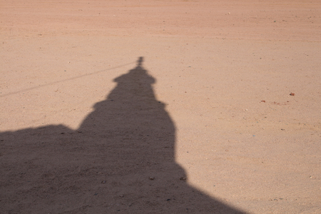 Shadow of the tower of a small bedouin mosque in the desert close to Hurghada in Egypt.の写真素材