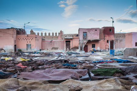 Late afternoon in the leather tanning factory in the center of Marrakesh, Morocco. Colorful place even after the work finished. Cloudy sky.の写真素材