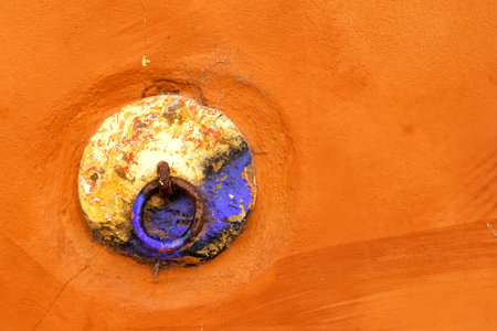 Doorknob painted by many colors. Base in bright orange. Downtown of Faro, Portugal.
