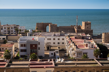 Skyview on the historical castle and houses of the city. Horizon of the Atlantic ocean in the background. Blue sky. Safi, Morocco.の写真素材