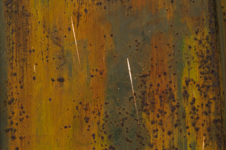 Various colors of the paintings, partly peeled off, partly rusted. Detail of an old metal gate....