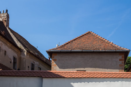 Lines of the roofs in the old downtown. Bright blue spring sky. Bratislava, Slovakia.