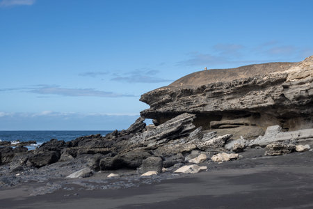 Coast of the Atlantic ocean, with volcanic scenic rocks of various shapes. Ocean with small waves....