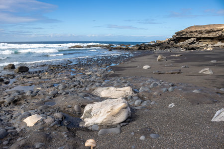 Coast of the Atlantic ocean, with volcanic scenic rocks of various shapes. Ocean with small waves....