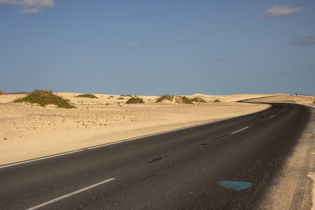 Good quality of the road through the desert. Sand of the dunes on both sides of the roads. No people...