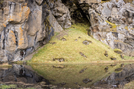 Detail of the hill with structured surface and a lake beside. Area of Kvernufoss, south-central Iceland.の写真素材