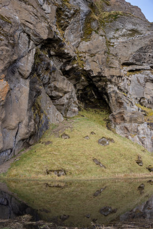 Detail of the hill with structured surface and a lake beside. Area of Kvernufoss, south-central Iceland.の写真素材