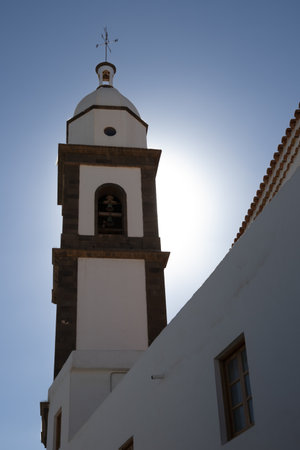 Church Parroquia de San GinÃ©s, located in the capital city. Tower in the opposite light, white facade. Arrecife, Lanzarote, Canary Islands, Spain.の写真素材