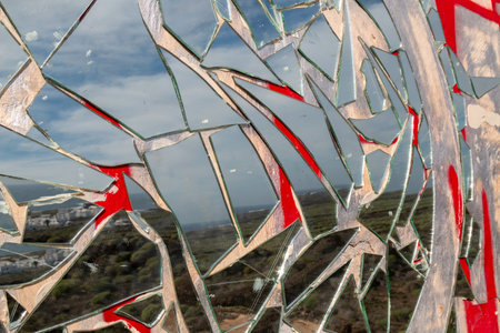 Abandoned simple building. Outer wall covered by graffiti and a mosaic made of pieces of mirror. Lanzarote, Canary Islands, Spain.の写真素材
