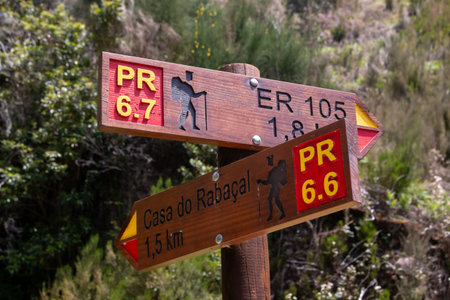 Wooden column with directions to the target of a hike. Levada das 25 fontes  Rabacal, Paul da Serra,...