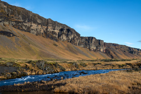 Mountain covered by moss and lichen. Volcanic rock with a structured shape on the top. Beautiful sunny day in the autumn.. South Iceland, close to Kalfafell.の写真素材