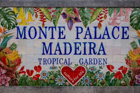 Colorful tiles (azulejos), creating a picture on the fence of Botanical garden. Tropical botanical garden Monte Palace in Funchal, Madeira, Portugal.の写真素材