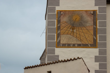 Sundial on the facade of a Church of Assumption of Virgin Mary. Old very well preserved detail....