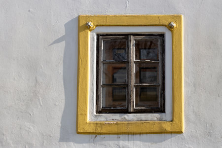 Window of a historical house built in style peasants baroque. Very well preserved building, part of UNESCO World Heritage Sites. Holasovice, Czech repbulic.の写真素材