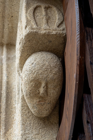 Stone head of a man on the gothic portal to the Church of Assumption of Virgin Mary. Kajov, Czech republic.の写真素材