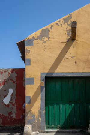 Various geometrical shapes and colors of an old house on the coast of Atlantic ocean. Bright blue sky. Las Palmas, Gran Canaria, Canary Islands, Spain.の写真素材