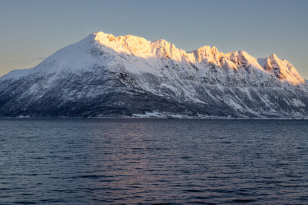 Nature and high mountains in the background, everything covered by snow in the late autumn. Calm...