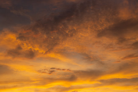 Cloudscape in bright orange colors during the sunset. Acharavi, Corfu (Korfu), Greece