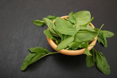 Fresh salad spinach isolated on black backgroundの写真素材