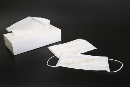 Disposable mask and mercury thermometer and box type tissueの写真素材