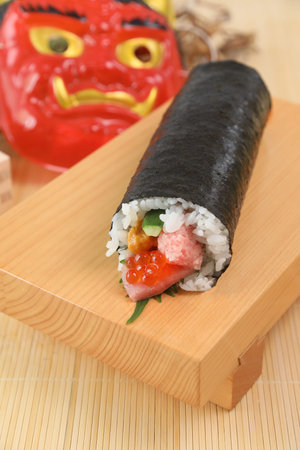 Ehomaki (literally, sushi roll of the blessing direction)
uncut sushi roll eaten during setsubun.の写真素材