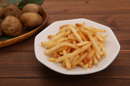The French fries which I served to a dish against a backdrop of a potato.