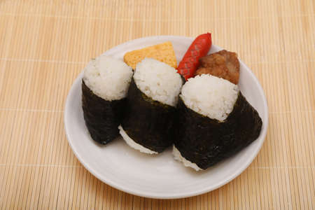 It is a very popular food in Japan. It is also called "omusubi" or "nigiri-meshi" and is often used for lunch boxes.の写真素材