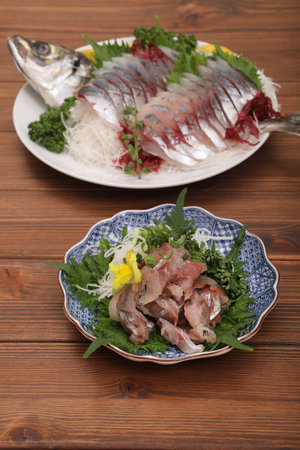 Fresh horse mackerel tataki served on a platter.
To mix chopped horse mackerel meat and spices, tap the meat as you chop it. This process of tapping the horse mackerel into small pieces is the originの写真素材