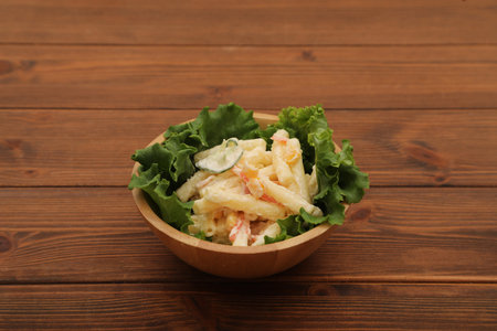 salad with macaroni  and mayonnaise in wooden bowlの写真素材
