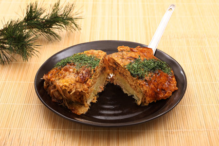 Hiroshima-style okonomiyaki with yakisoba noodles topped with green laver.の写真素材