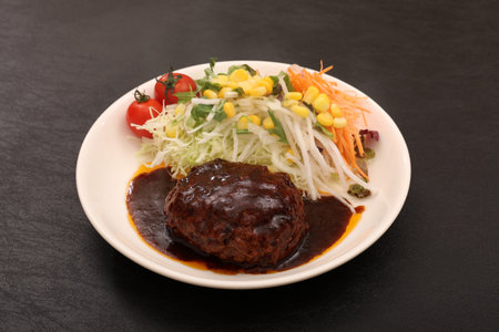 Hamburger steak and cherry tomato salad
