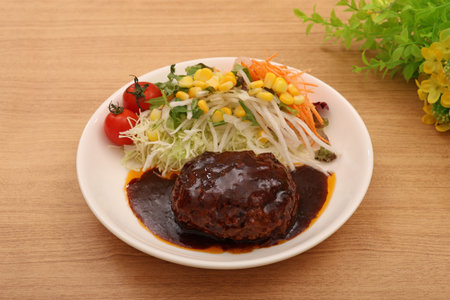 Hamburger steak and cherry tomato salad