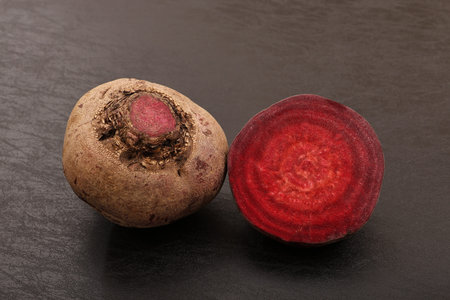 Beetroot and beetroot on a black background. Close-up.