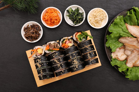 Kimbap is a Korean-style nori roll, which is rolled with rice mixed with sesame oil, salt, and other ingredients on top of nori.の写真素材