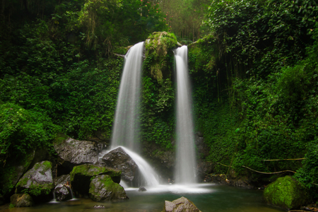 Grenjengan Kembar Waterfall, Twin Waterfalls in the Middle of the Wildernessの写真素材