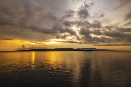 Sunrise at the East End of Java Island, Watu Dodol Beach, Banyuwangiの写真素材