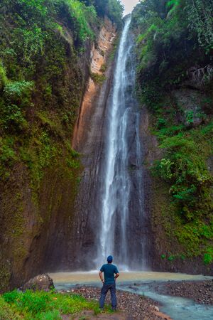 Sidoharjo Waterfall Located in Middle of Forest in Menoreh Highland, Indonesiaの写真素材